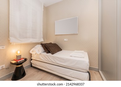 Youth Bedroom With Bedding, Built-in Wardrobe With Gray Sliding Doors And Wooden Floors, White Cloth Blinds