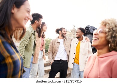 Youth Culture. Group Of Young People Laughing And Talking Outdoors In The City. Happy Friends Having Fun Together