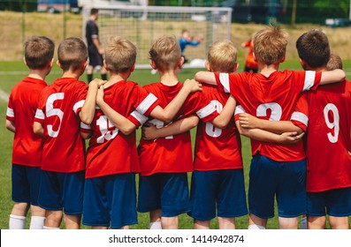 Youth european football team in red shirts. Young boys of soccer club on the stadium during final competition. Kids soccer team in huddle on field. Soccer penalty shootout  - Powered by Shutterstock