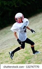 Youth Football Boy Going Out For A Pass.