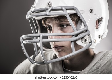 Youth Football Player With Helmet On