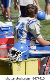 Youth Football Player On Bench