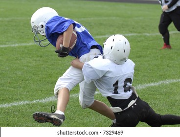 Youth Football Player Tackles Another.