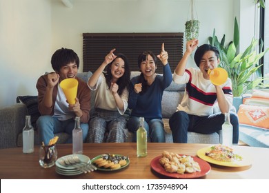 Youth group watching TV and supporting - Shutterstock ID 1735948904