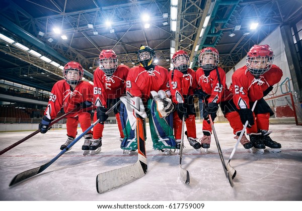 Youth hockey\
team - children play ice\
hockey\
