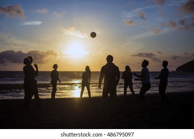 Youth playing games on the beach