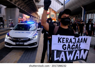 Youth Protesters Carry A Black Flag To Demand The Resignation Of Malaysia Prime Minister Muhyiddin Yassin Near The Independent Square In Kuala Lumpur, Malaysia On July 31, 2021