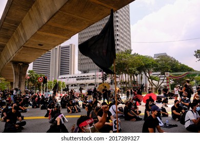 Youth Protesters Carry A Black Flag To Demand The Resignation Of Malaysia Prime Minister Muhyiddin Yassin Near The Independent Square In Kuala Lumpur, Malaysia On July 31, 2021