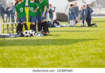 Youth soccer football team. Group photo. Soccer players standing together united. Soccer team huddle. Teamwork, team spirit and teammate example.
