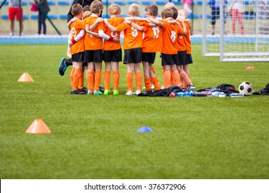 Youth Soccer Football Team. Group Photo. Soccer Players Standing Together United. Soccer Team Huddle. Teamwork, Team Spirit And Teammate Example.