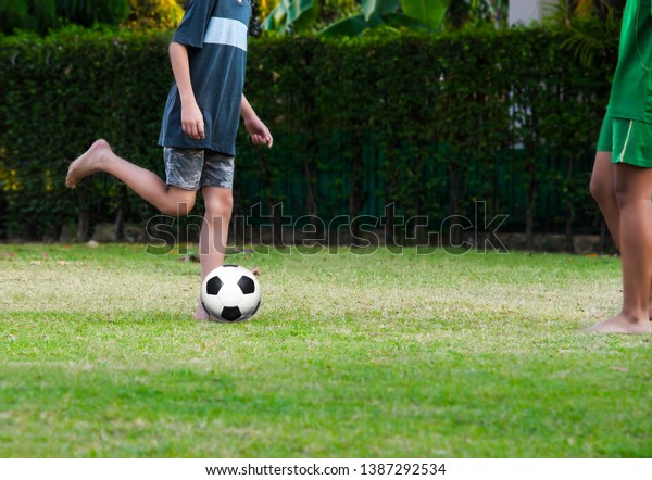 Youth soccer\
practice drills with cones. Soccer drills: slalom drill. Young\
football players training on\
pitch