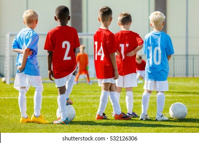 Youth Soccer Training Session. Children Football Training. Coaching Youth Soccer. Young Boys Training Football On Pitch