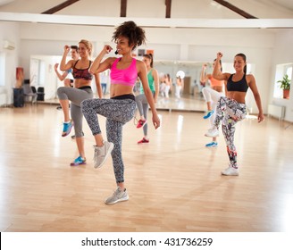 Youth Takes Care Of Their Appearance Using Body Exercises In Fitness Center