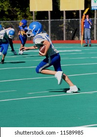 Youth Teen Football Player Running With Football