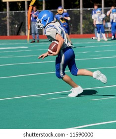 Youth Teen Football Player Running With Football 2