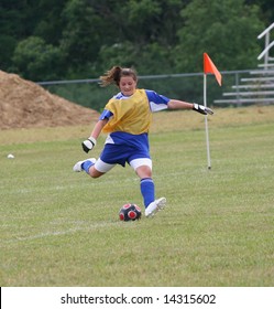 Youth Teen Goalie Kicking Soccer Ball