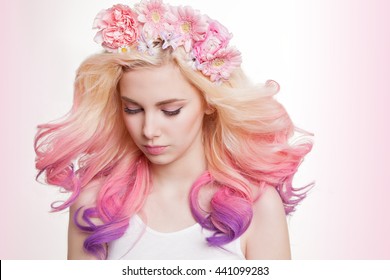 Youth women and curly colored hair   flowers  white   pink background  Beauty