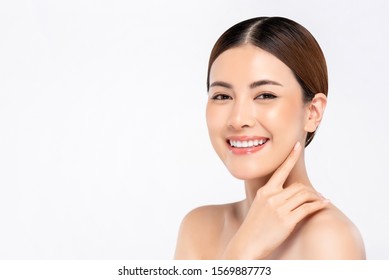 Youthful Bright Skin Smiling Pretty Asian Woman With Hand Touching Face On White Background For Beauty Concepts