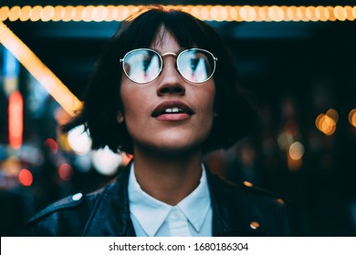 Youthful Female Traveller In Stylish Spectacles For Vision Correction Spending Time For Walking Around Metropolitan Downtown And Explore New York Nightlife On Leisure, Young Woman In Streetwear