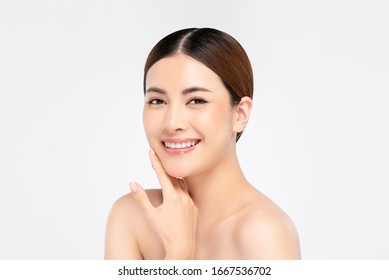 Youthful Pretty Asian Woman With Hand Touching Face On White Background For Beauty And Skin Care Concepts