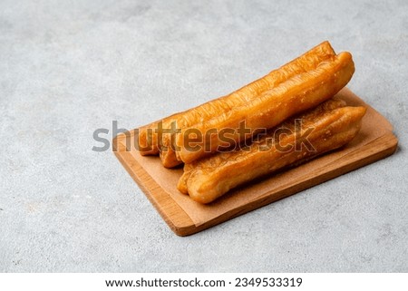 Youtiao or Yu Char Kway is a long golden-brown deep-fried strip of wheat flour dough of Chinese origin 