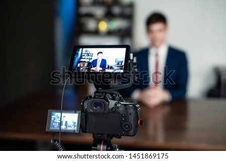 YouTuber concept. Young caucasian man in video recording studio.