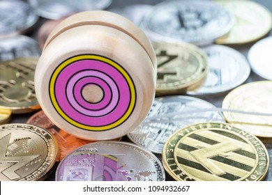 Yoyo Effect Of Crypto Currency Price Up So High And Down, Wooden Yo-yo Toy On Various Of Physical Cryptocurrencies Coins, Bitcoin, Litecoin, Zcash, Ripple.