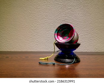 Yoyo On The Table With Yellow Lighting