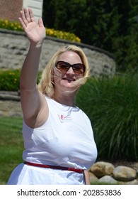 YPSILANTI, MI - JULY 4: Michigan State Senator Rebekah Warren Waves At The 4th Of July Parade On July 4, 2014 In Ypsilanti, MI.