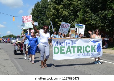 YPSILANTI, MI / USA - JULY 4, 2018:  Michelle Deatrick, democratic candidate for Michigan State Senate, marches in the Ypsilanti Fourth of July parade. 