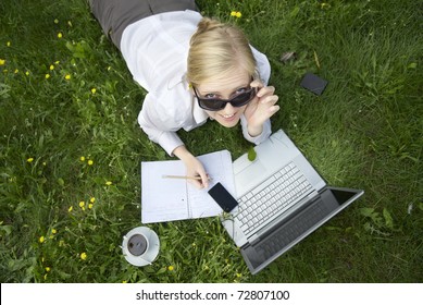 Ypung Woman Working Outside On Computer