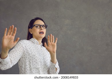 Yuck. Scared Woman With Expression Of Fear, Fright And Disgust On Face Asking You To Stop. Young Lady On Grey Studio Background Afraid Of Something Dangerous Or Repulsive Doing Protective Hand Gesture