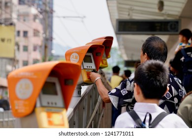 Yuen Long, Hong Kong - 22 September 2018: Passenger Pay To Enter The Train Platform With Their 