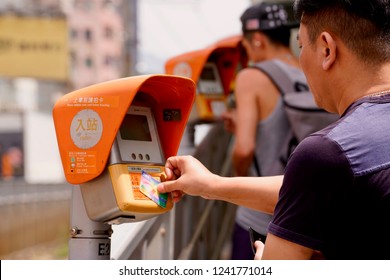 Yuen Long, Hong Kong - 22 September 2018: Passenger Pay To Enter The Train Platform With Their 