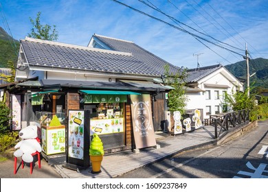 YUFUIN,OITA,JAPAN-SEPTEMBER 19,2019:  Snoopy Doll In Front Of The Soft Serve Shop At Yufuin Walking Street