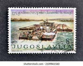 Yugoslavia - circa 1981 : Cancelled postage stamp printed by Yugoslavia, that shows Locomotive Pulls Ship Through Channel, 125th Anniversary of the European Danube Commission, circa 1981.