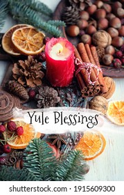 Yule Blessings. Winter Altar For Yule Sabbath. Pagan Holiday. Red Candle, Wheel Of The Year, Cinnamon, Nuts, Cones, Dry Orange Slices. Esoteric Ritual For Yuletide, Magical Winter Solstice