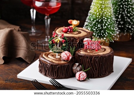 Yule log chocolate cake with chocolate frosting for Christmas