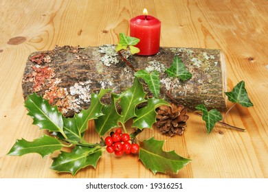 Yule Log With Lit Candle Holly And Ivy