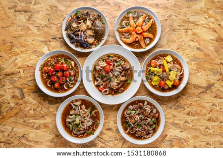 Yum, Spicy salad, spicy Thai food, mixed on the table,Collection set of Spicy salad (Yum Thai style) Traditional spicy -hot seafood, egg Thai food. Thai cuisine delicious food popular 