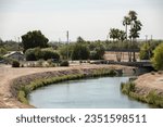 Yuma, Arizona, USA - May 27, 2022: Afternoon sun shines on the historic Yuma Main Canal in Downtown Yuma.