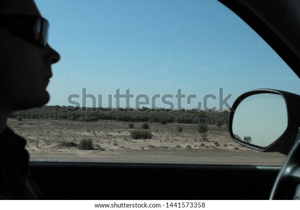 Yuma Sector, Ariz. / US - April 11, 2013: A Customs\
and Border Protection agent during a shift along the US-Mexico\
border. 1800