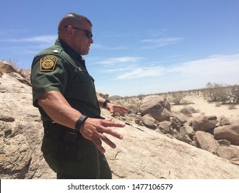 Yuma Sector, Ariz. / US - July 26, 2016: A Customs And Border Protection Agent Along The U.S.-Mexico Border. 0408