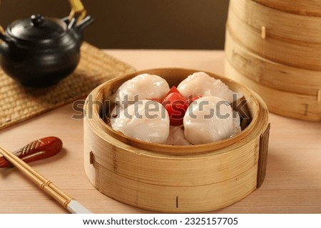 yumcha, dim sum,Steamed prawn dumpling in a bamboo steamer