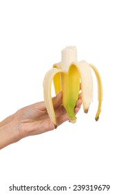 Yummy banana. Close up of woman's hand holding a bitten banana. Studio shot isolated on white.
