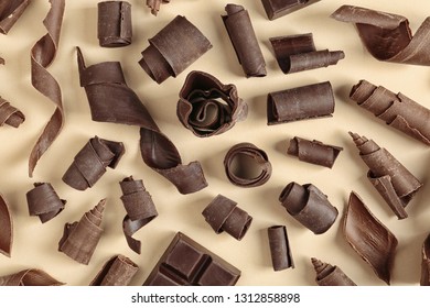 Yummy Chocolate Curls On Color Background, Top View