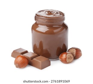 Yummy chocolate paste in jar, hazelnuts and piece of chocolate bar isolated on white