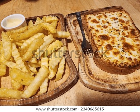 Yummy Frenchfries and delicious cheese bread