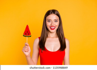 Yummy! Sweet Summer! Close Up Portrait Of Attractive Lovely Woman Holding Piece On Caramel Fruit On Stick, Isolated On Bright Yellow Background