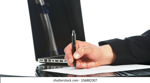 A Yuong Business Man Writing In A Paper